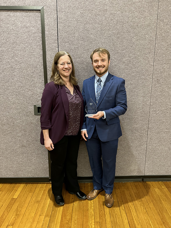 Hunter Willyard recieving his award from Jennifer Anthony