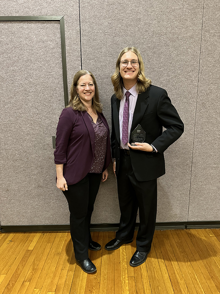 Michale Paddock recieving his award from Jennifer Anthony